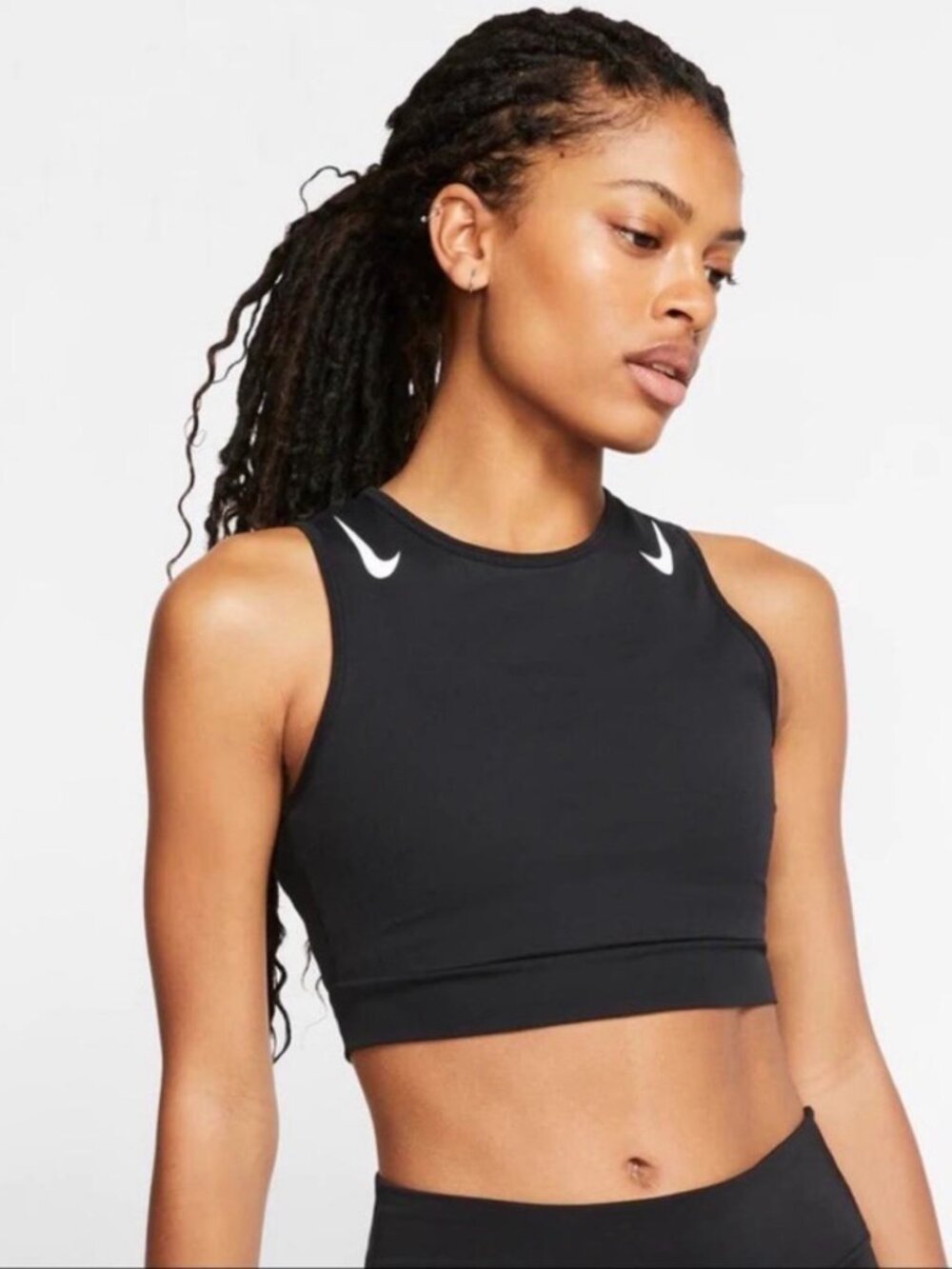 Nike black sports crop top with white swoosh logo